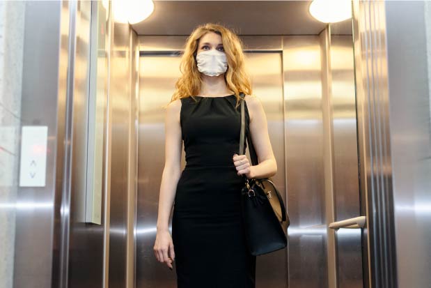 uv-health-group-home-woman-elevator-mask